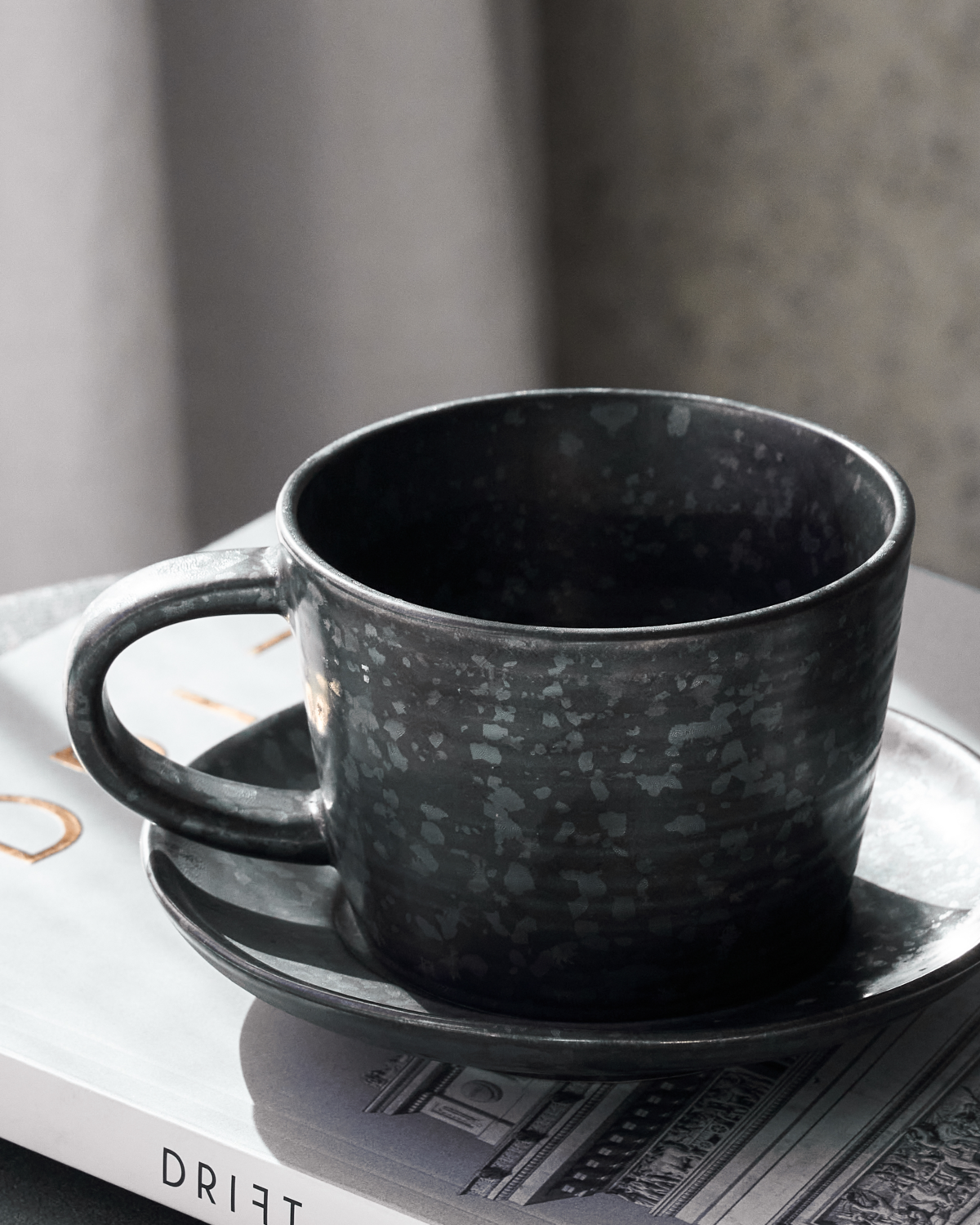 Pion cup and saucer - black - by House Doctor
